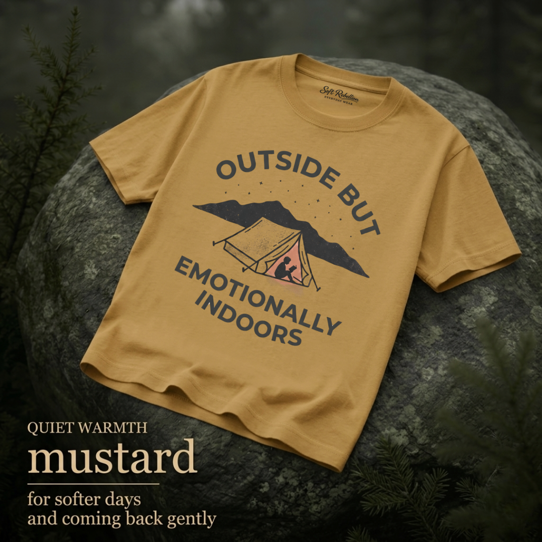 Mustard garment-dyed Comfort Colors tee reading "Outside but Emotionally Indoors", Soft Rebellion