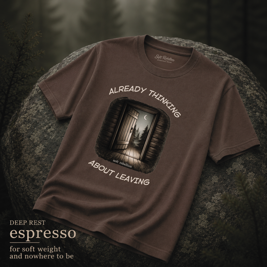 Espresso garment-dyed Comfort Colors tee reading "Already Thinking About Leaving", Soft Rebellion
