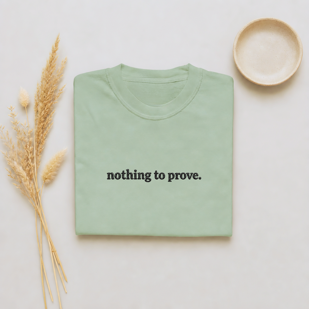 Bay garment-dyed Comfort Colors tee with "nothing to prove" embroidered on the chest, Soft Rebellion