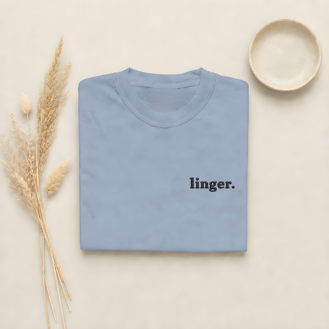 Blue Jean garment-dyed Comfort Colors tee with "linger" embroidered on the chest, Soft Rebellion