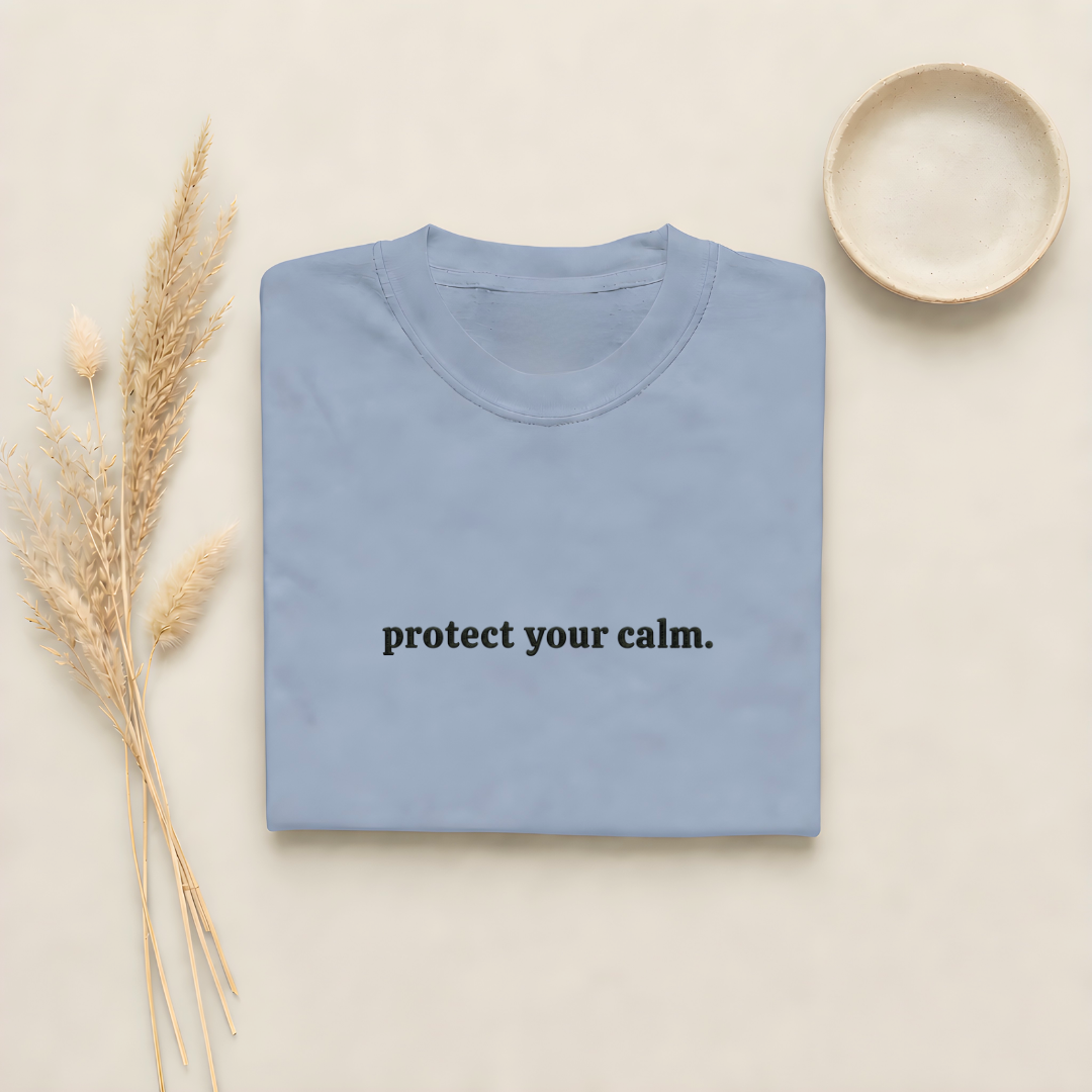 Blue Jean garment-dyed Comfort Colors tee with "protect your calm" embroidered on the chest, Soft Rebellion