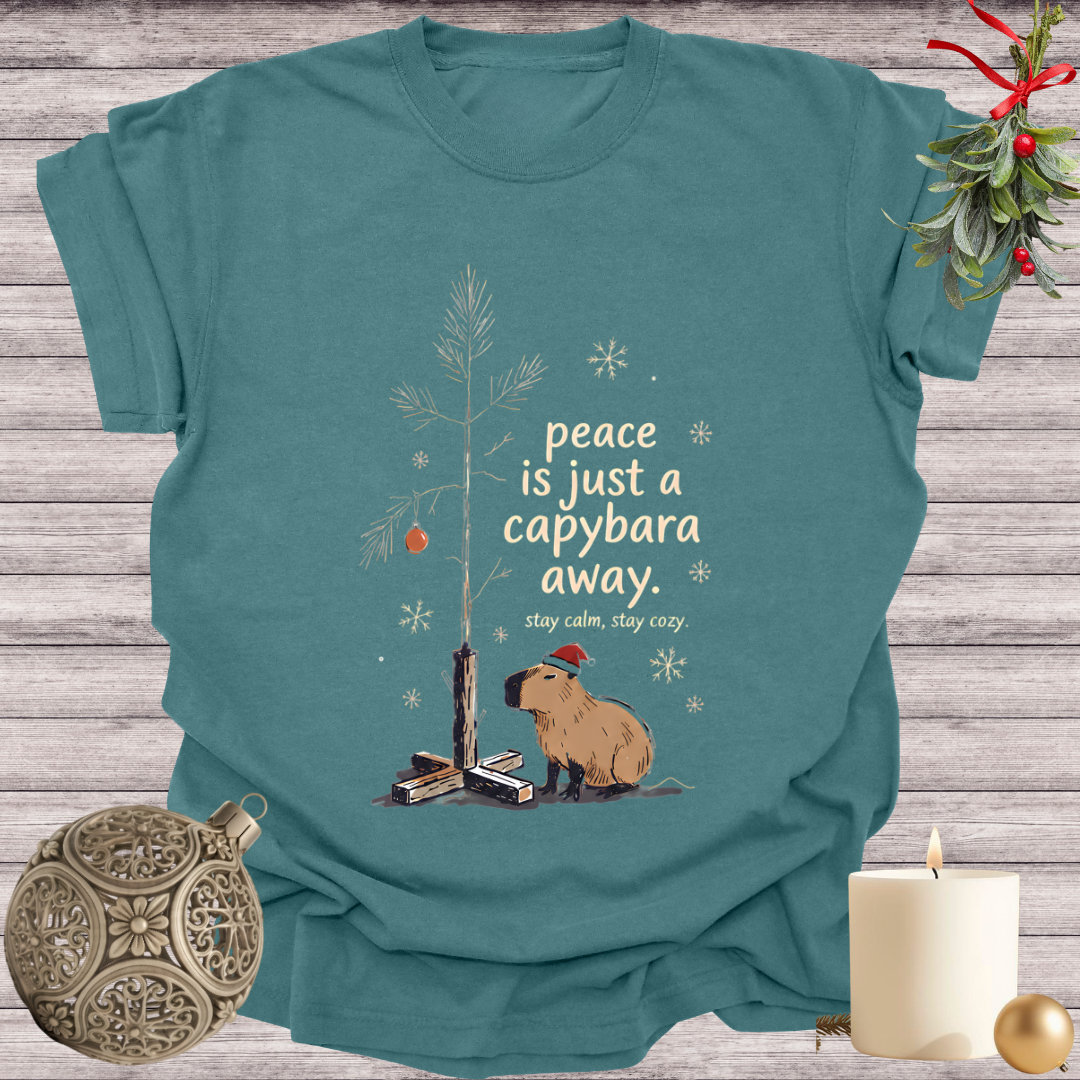 Blue Spruce garment-dyed Comfort Colors tee reading "peace is just a capybara away", Soft Rebellion