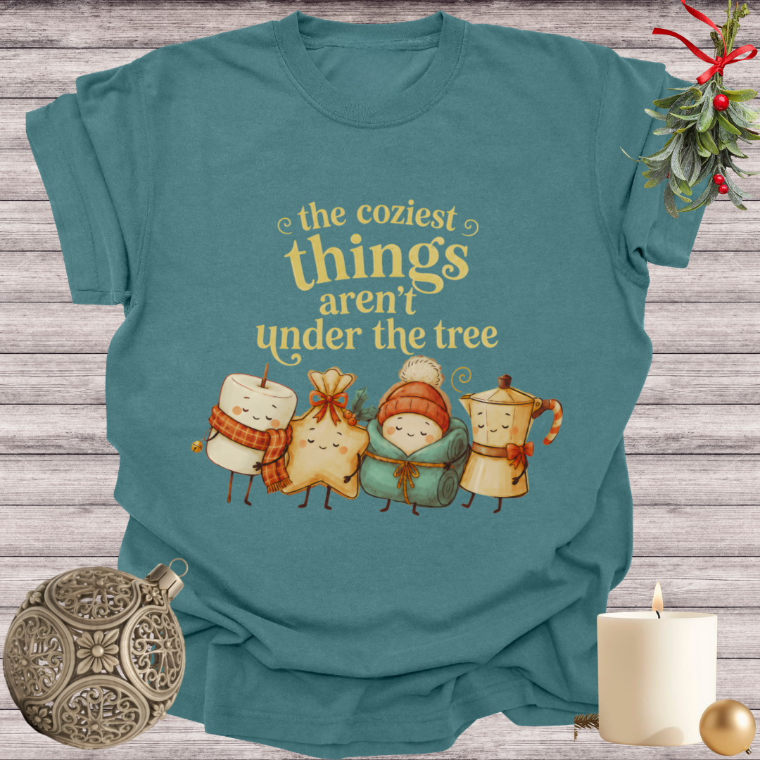 Blue Spruce garment-dyed Comfort Colors tee reading "the coziest things aren't under the tree", Soft Rebellion