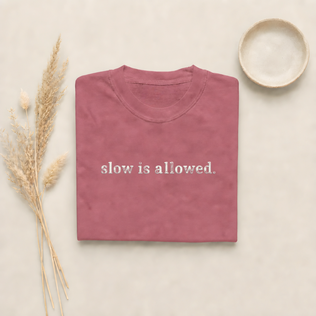Brick garment-dyed Comfort Colors tee with "slow is allowed" embroidered on the chest, Soft Rebellion