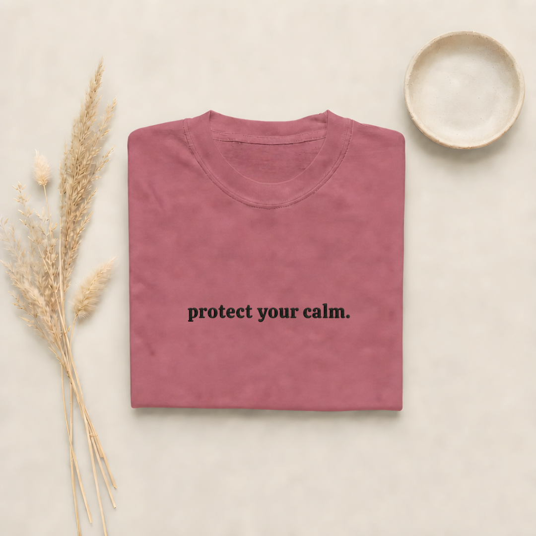 Brick garment-dyed Comfort Colors tee with "protect your calm" embroidered on the chest, Soft Rebellion
