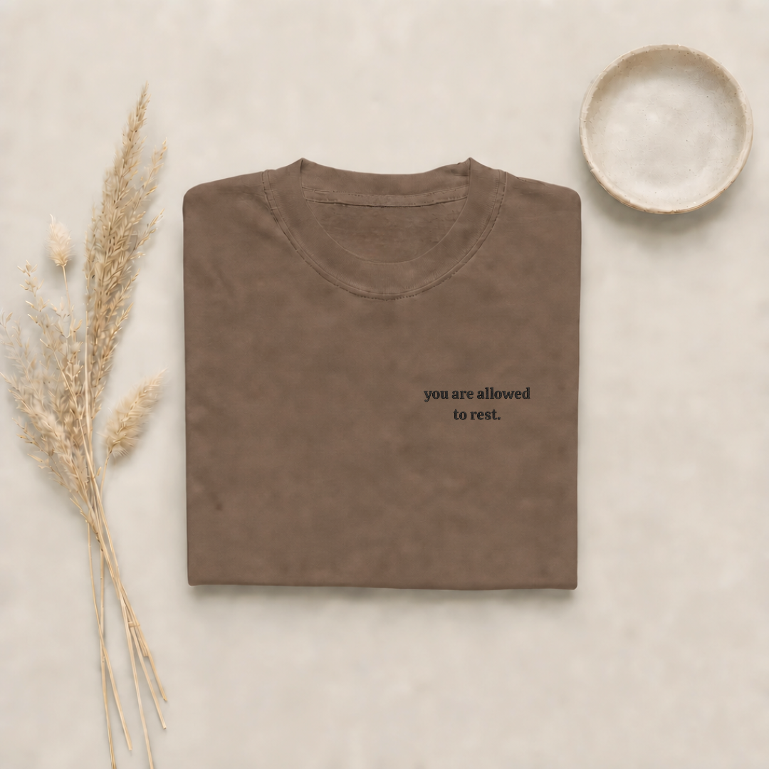 Espresso garment-dyed Comfort Colors tee with "you are allowed to rest" embroidered on the chest, Soft Rebellion
