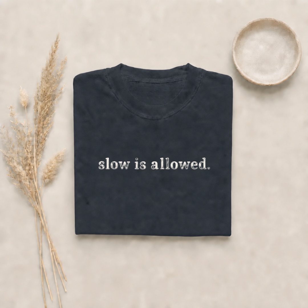 Graphite garment-dyed Comfort Colors tee with "slow is allowed" embroidered on the chest, Soft Rebellion