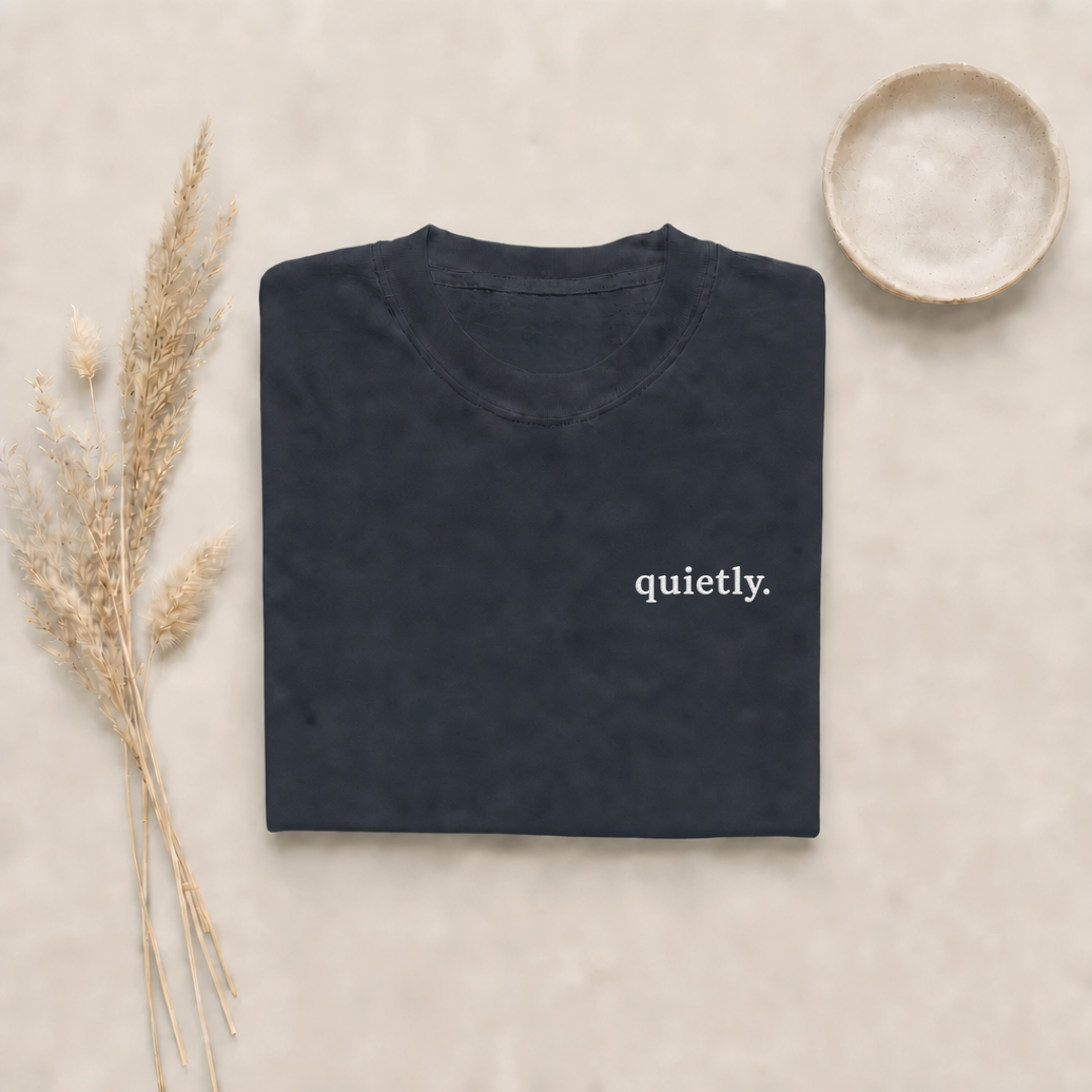 Graphite garment-dyed Comfort Colors tee with "quietly" embroidered on the chest, Soft Rebellion