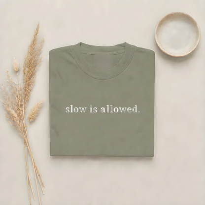 Moss garment-dyed Comfort Colors tee with "slow is allowed" embroidered on the chest, Soft Rebellion