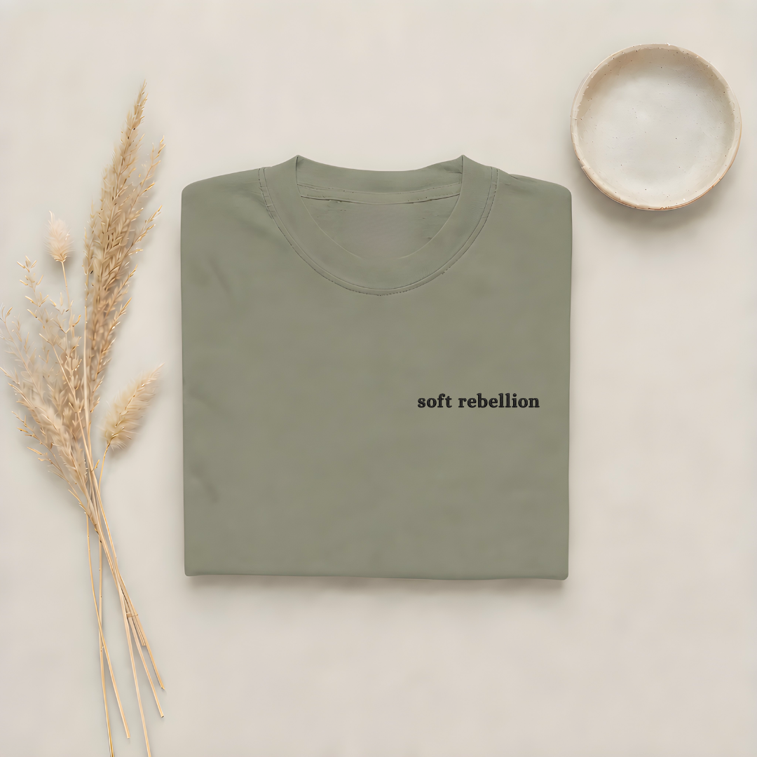 Moss garment-dyed Comfort Colors tee with Soft Rebellion embroidered on the chest