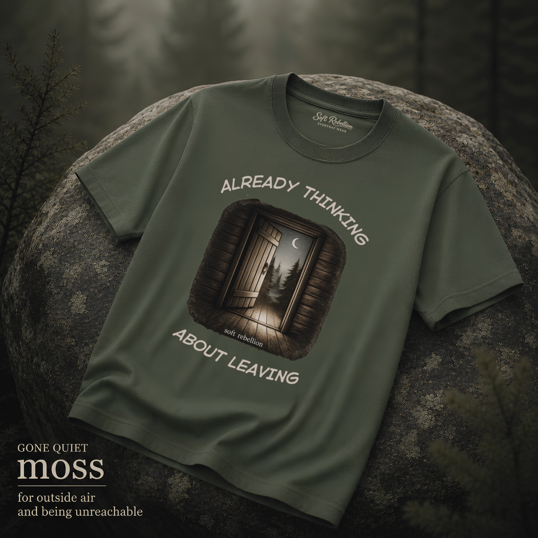 Moss garment-dyed Comfort Colors tee reading "Already Thinking About Leaving", Soft Rebellion