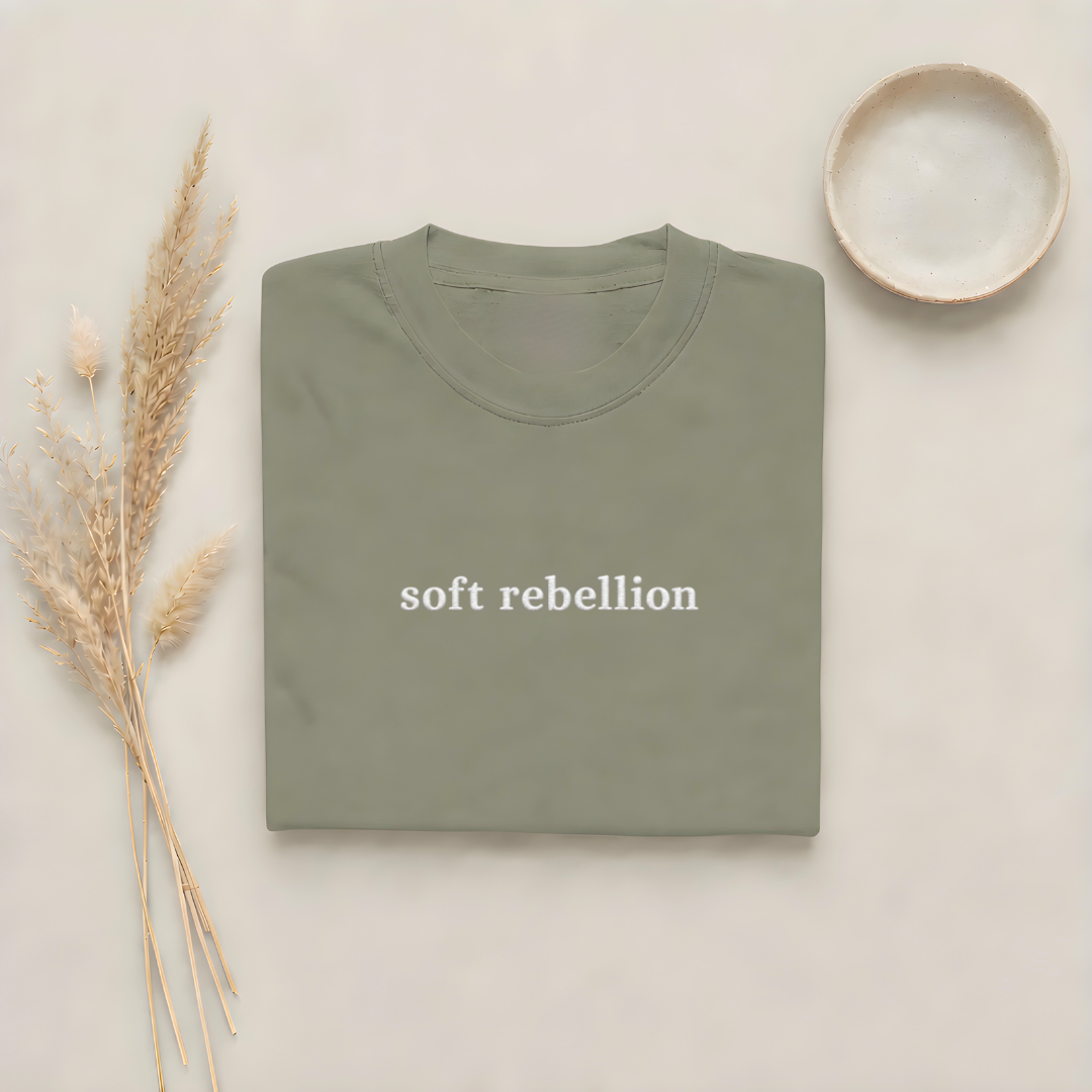 Moss garment-dyed Comfort Colors tee with Soft Rebellion embroidered on the center chest