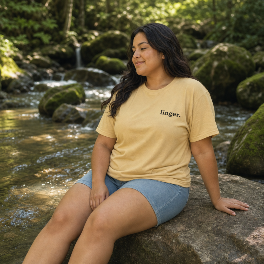 Mustard garment-dyed Comfort Colors tee with "linger" embroidered on the chest, Soft Rebellion