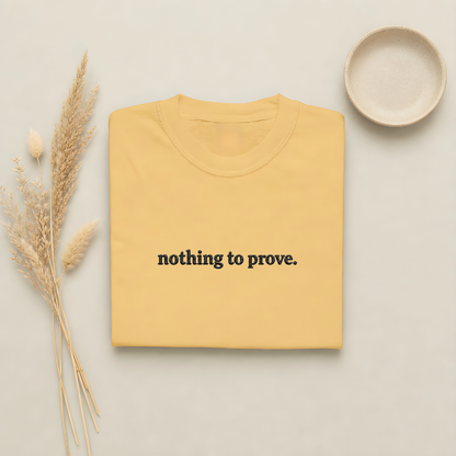 Mustard garment-dyed Comfort Colors tee with "nothing to prove" embroidered on the chest, Soft Rebellion