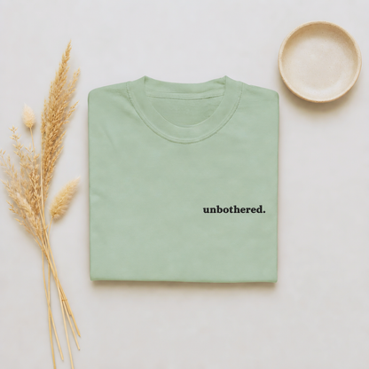 Bay garment-dyed Comfort Colors tee with "unbothered" embroidered on the chest, Soft Rebellion