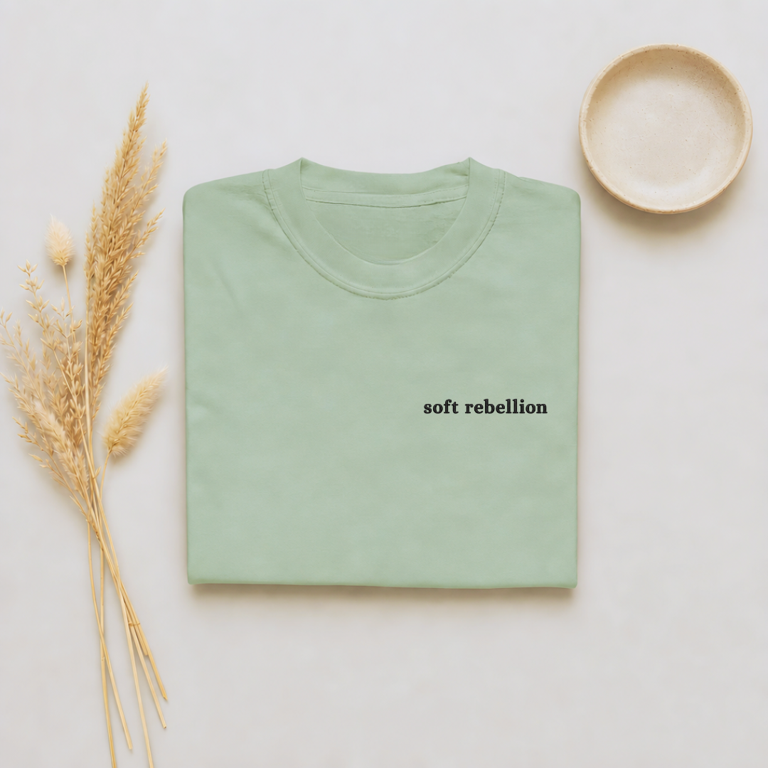 Bay garment-dyed Comfort Colors tee with Soft Rebellion embroidered on the chest