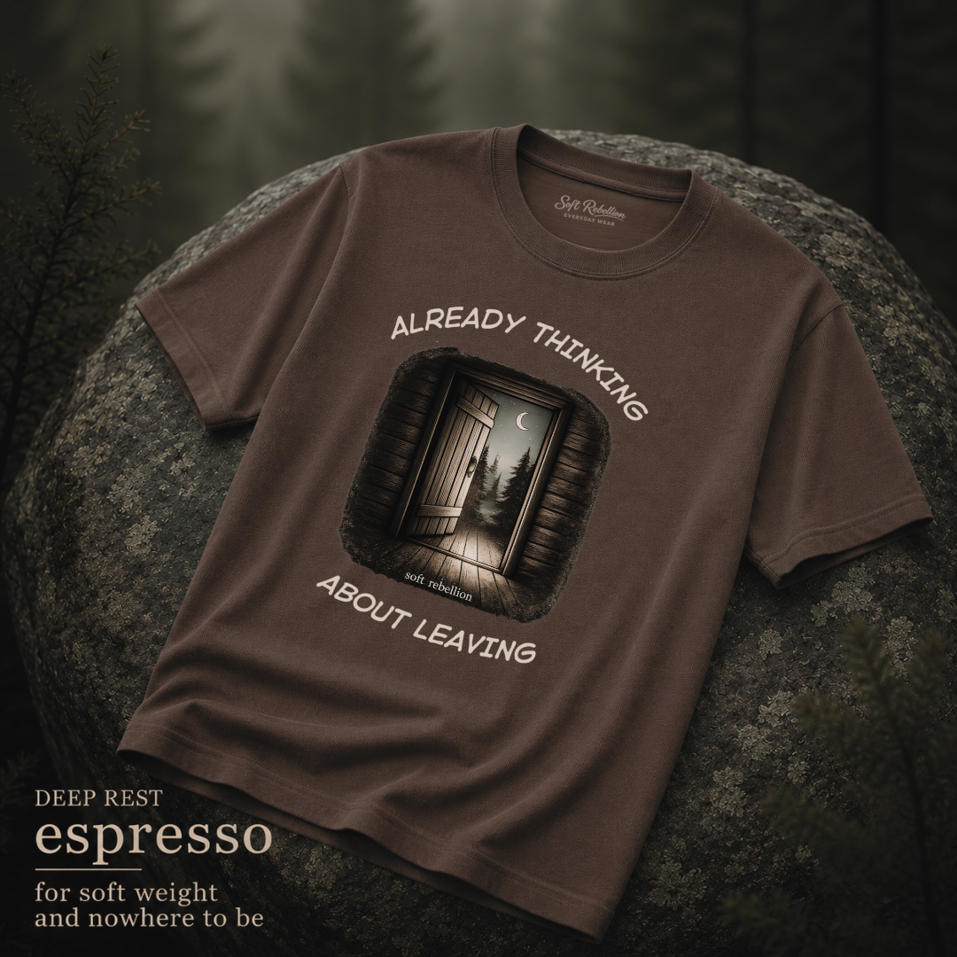 Espresso garment-dyed Comfort Colors tee reading "Already Thinking About Leaving", Soft Rebellion