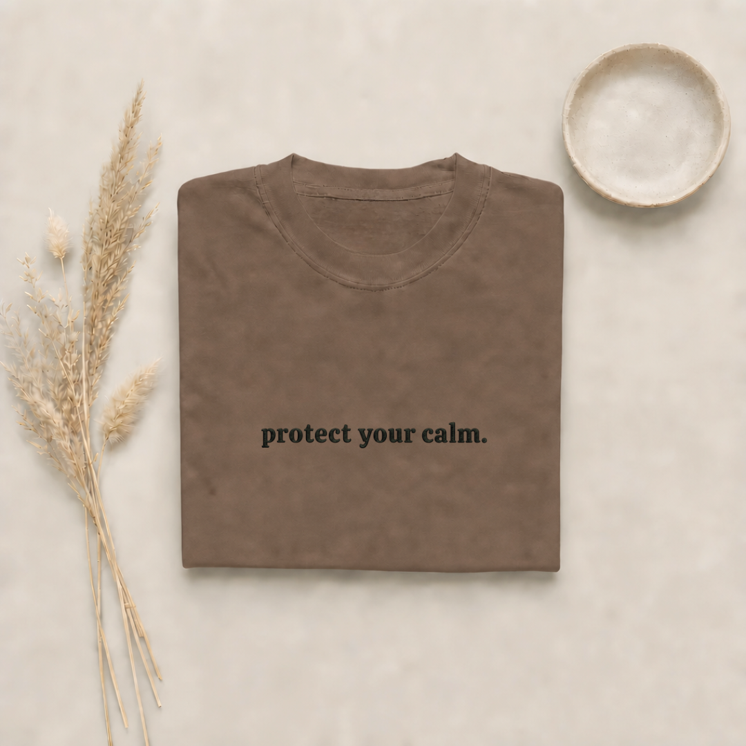 Espresso garment-dyed Comfort Colors tee with "protect your calm" embroidered on the chest, Soft Rebellion