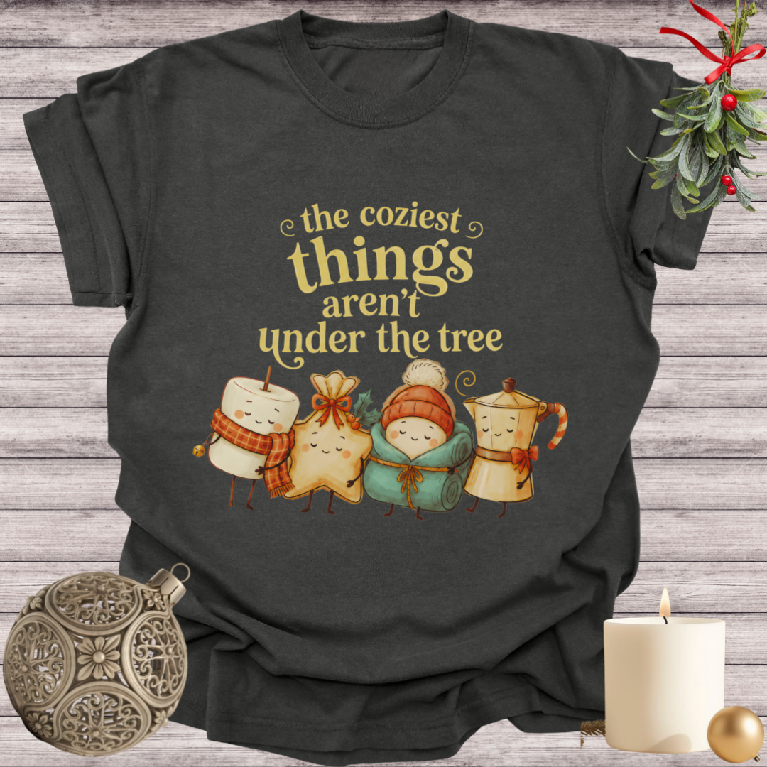 Pepper garment-dyed Comfort Colors tee reading "the coziest things aren't under the tree", Soft Rebellion
