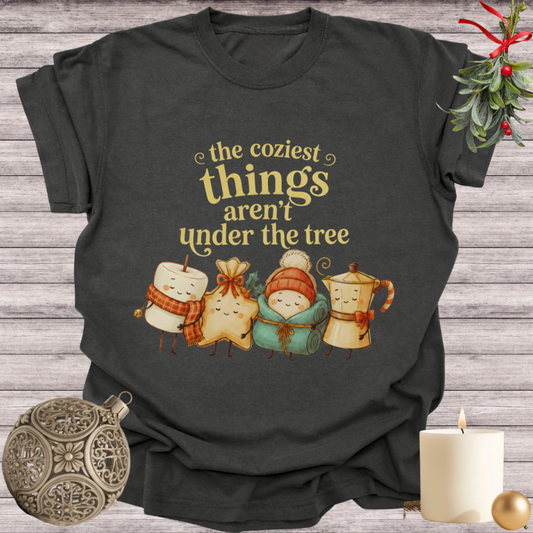 Pepper garment-dyed Comfort Colors tee reading "the coziest things aren't under the tree", Soft Rebellion